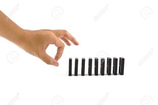9623181-hand-ready-to-push-domino-pieces-to-cause-chain-reaction-stock-photo